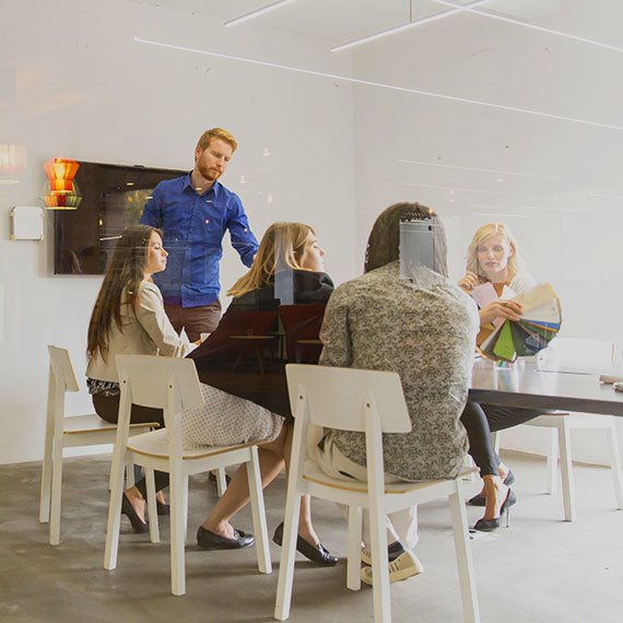a group of people sitting around a table